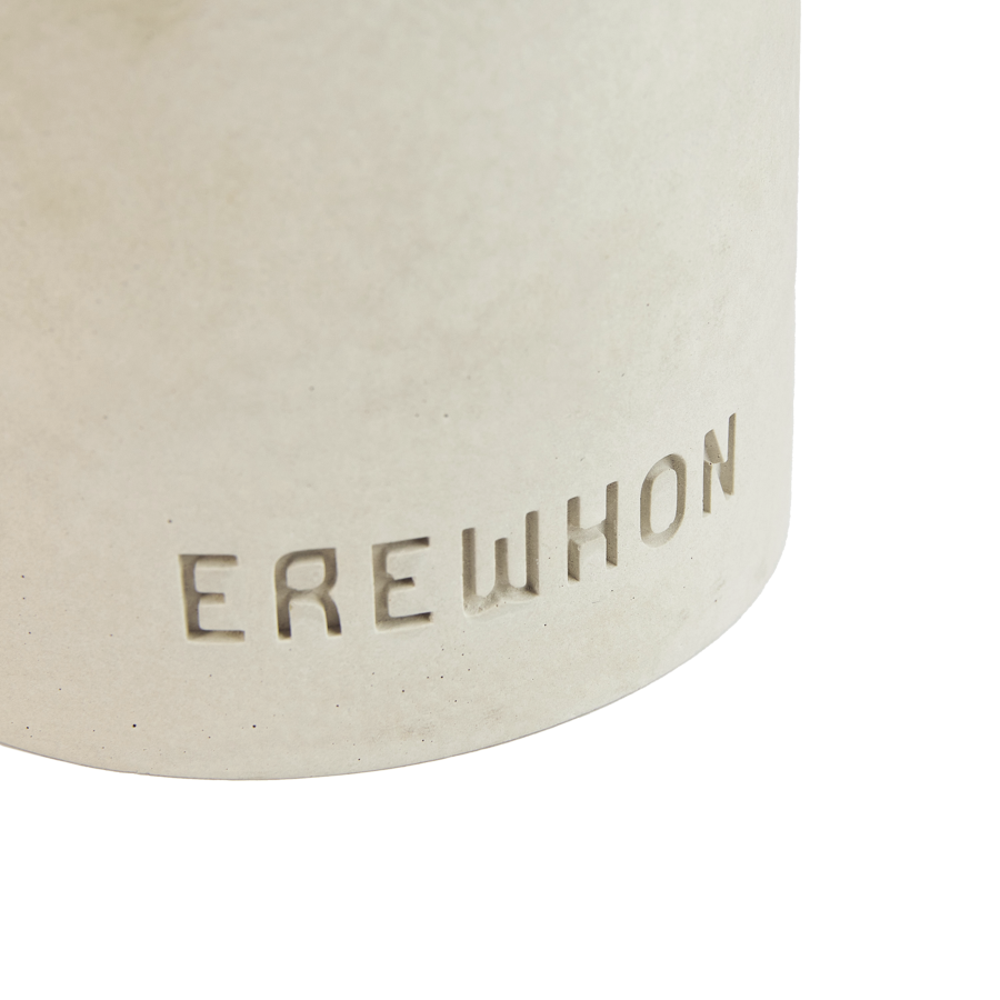 Erewhon's artisanal Yuzu Hinoki cement candle with cotton wick for clean burning