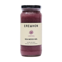 Close-up of Erewhon Cosmic Berry Sea Moss Gel in a glass jar, highlighting its vibrant color and texture, set against a clean, white backdrop for contrast